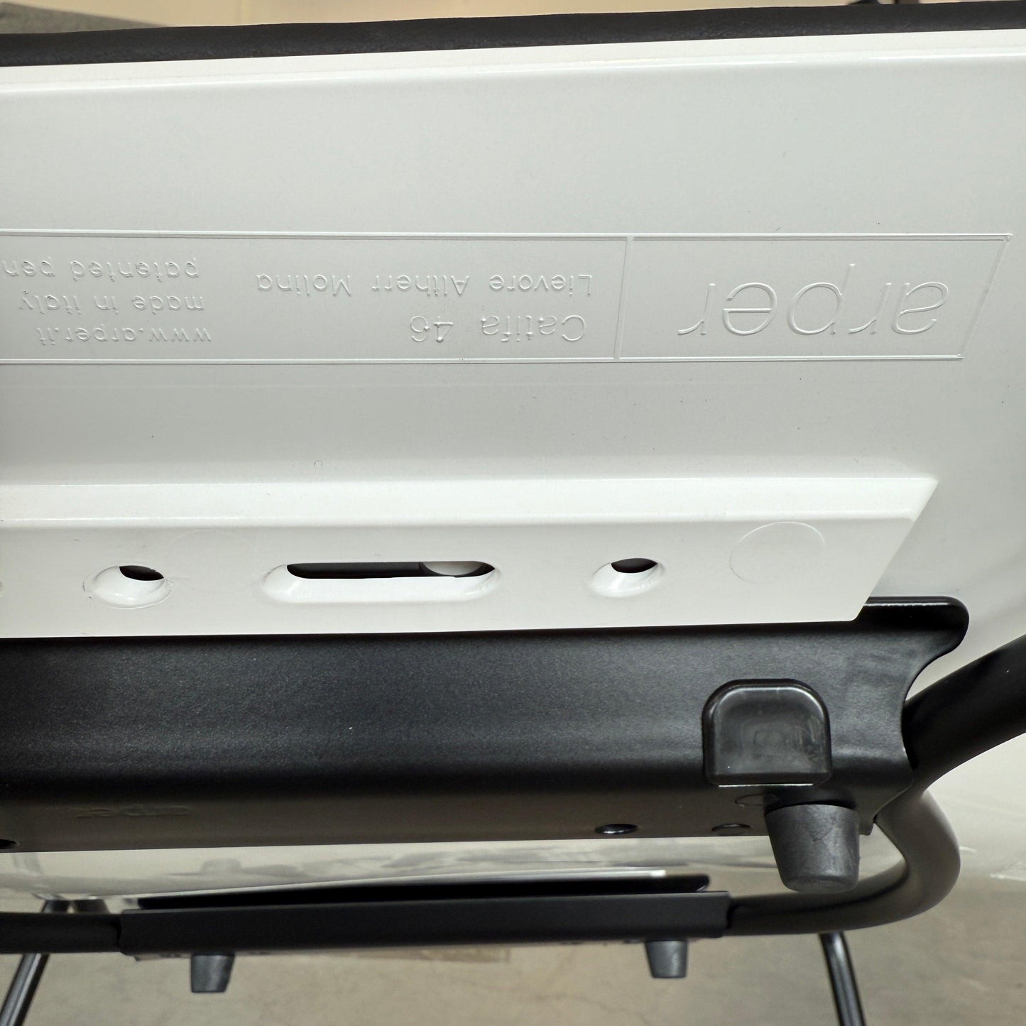Arper Catifa 46 black leather seat with white shell and sled base chair bottom view