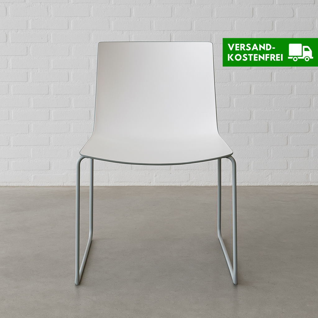 Arper Catifa 46 chair with white seat and steel sled base against white brick wall