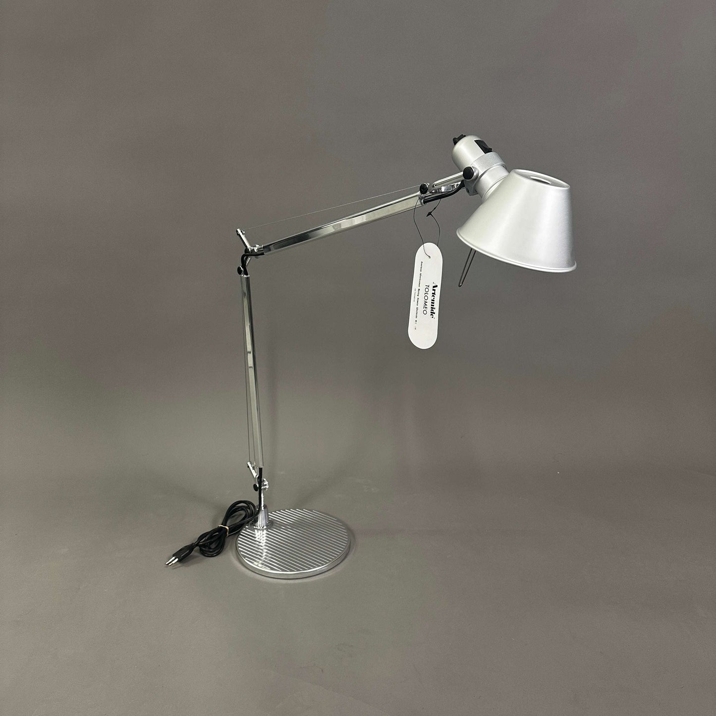 Artemide Tolomeo Tavolo polished aluminum adjustable desk lamp with round base and conical shade