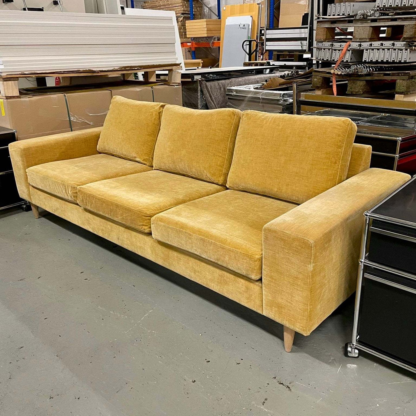 BoConcept Indivi yellow three-seater sofa with modern design and fabric upholstery