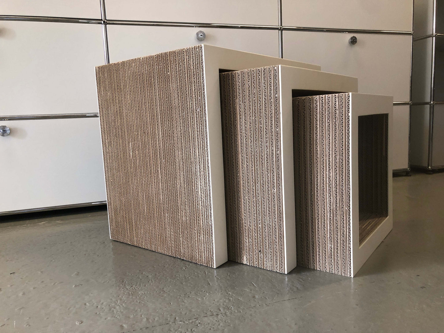 Frank Gehry Low Table Set with three white matte lacquered wooden tables featuring corrugated cardboard sides.