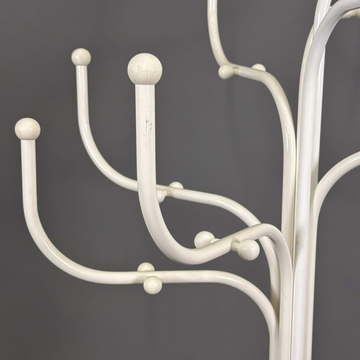 Fritz Hansen white Coat Tree coat rack with curved hooks and rounded ends against gray background