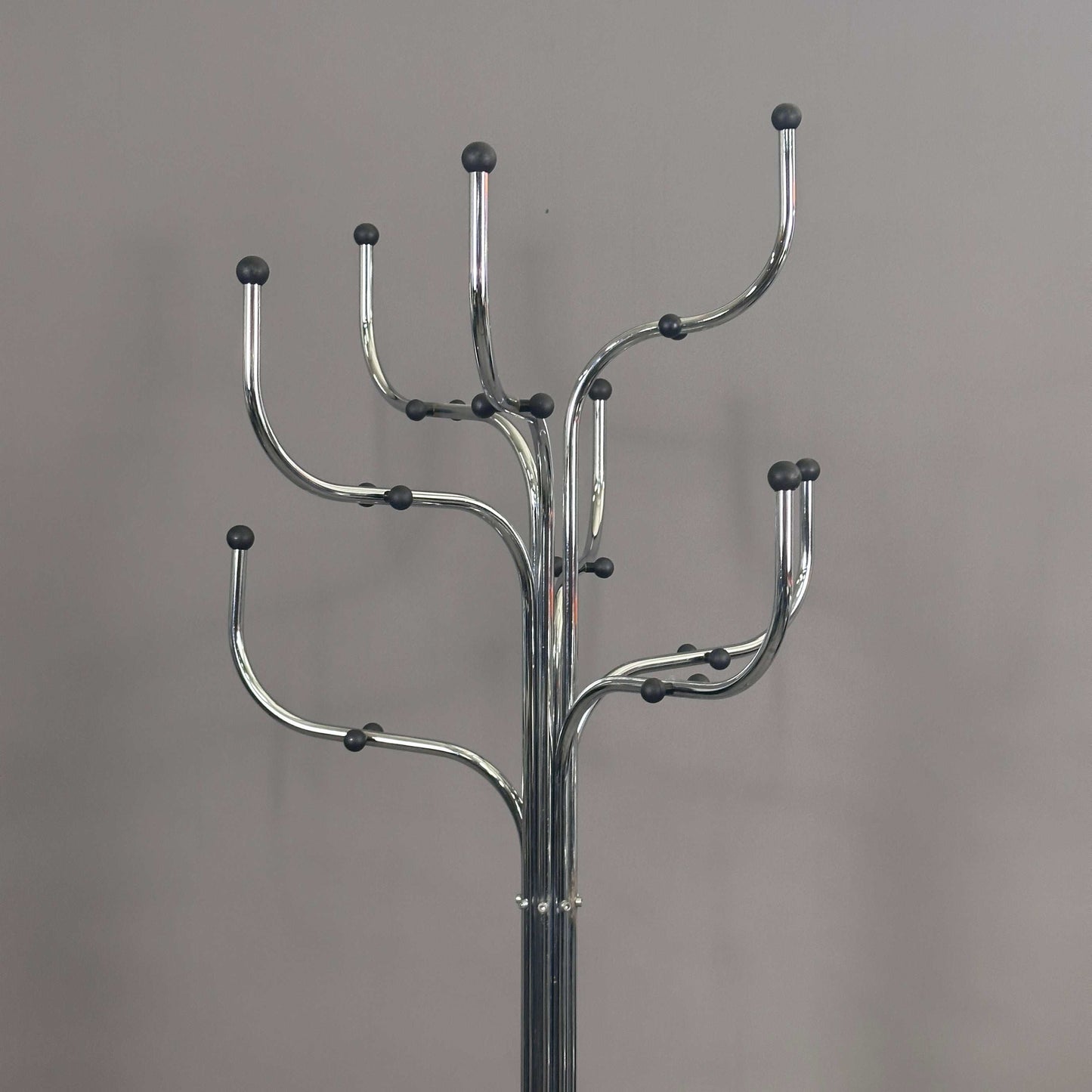 Silver Fritz Hansen Coat Tree with multiple curved hooks for hanging coats.
