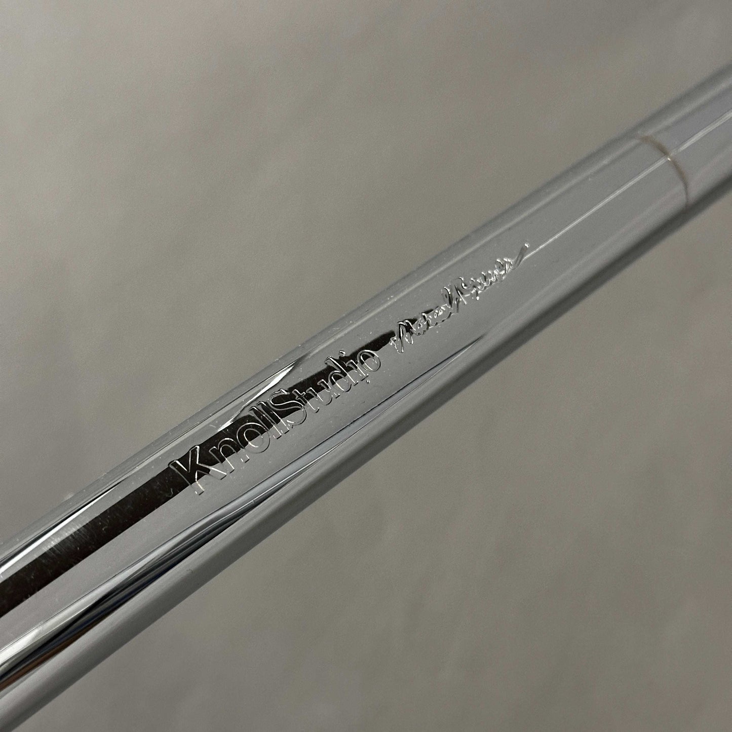 Close-up of chrome-plated steel tube with Knoll Breuer engraving on Knoll Breuer Laccio side table frame