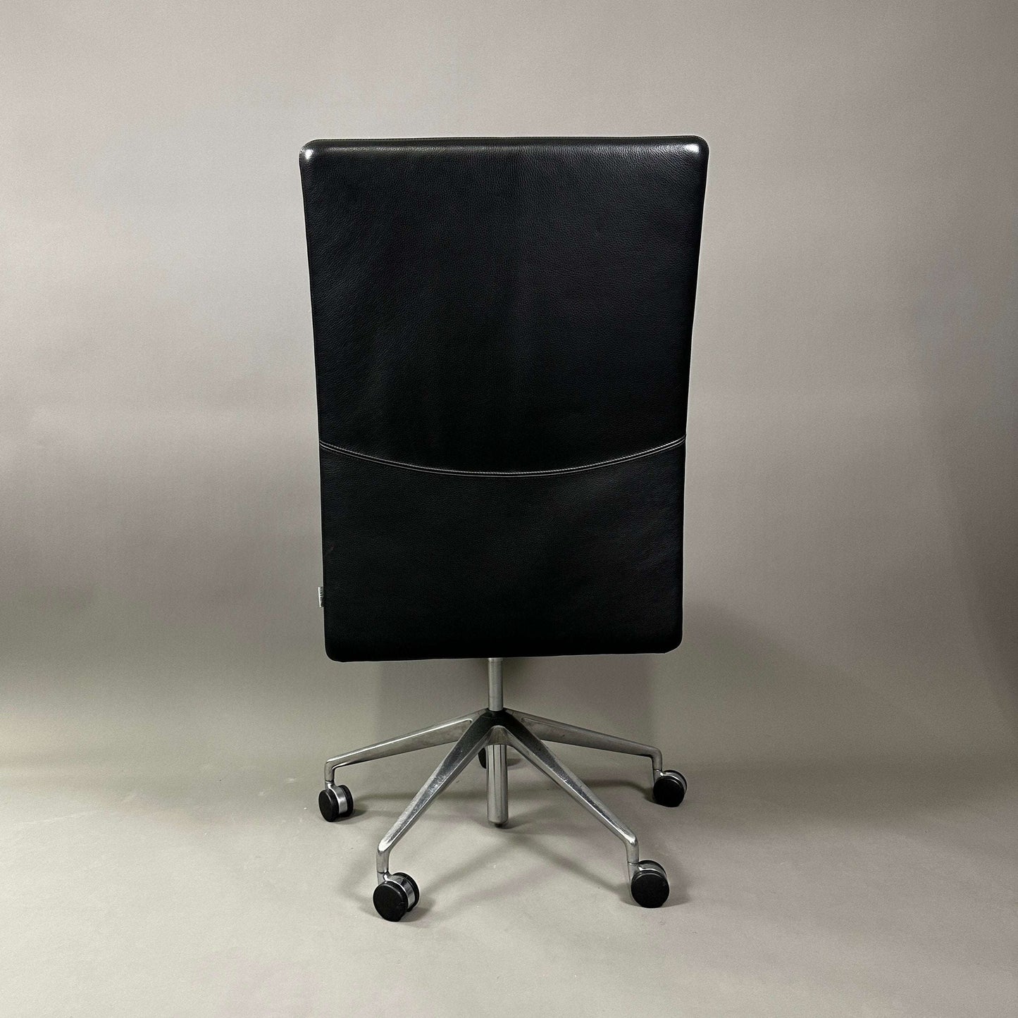 Black leather Knoll Jason office chair with height adjustment and lockable backrest viewed from the back
