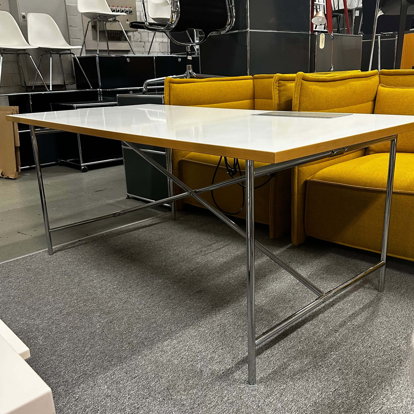 Lampert Eiermann Tisch with white top and chrome crossed central frame, minimalist design office desk