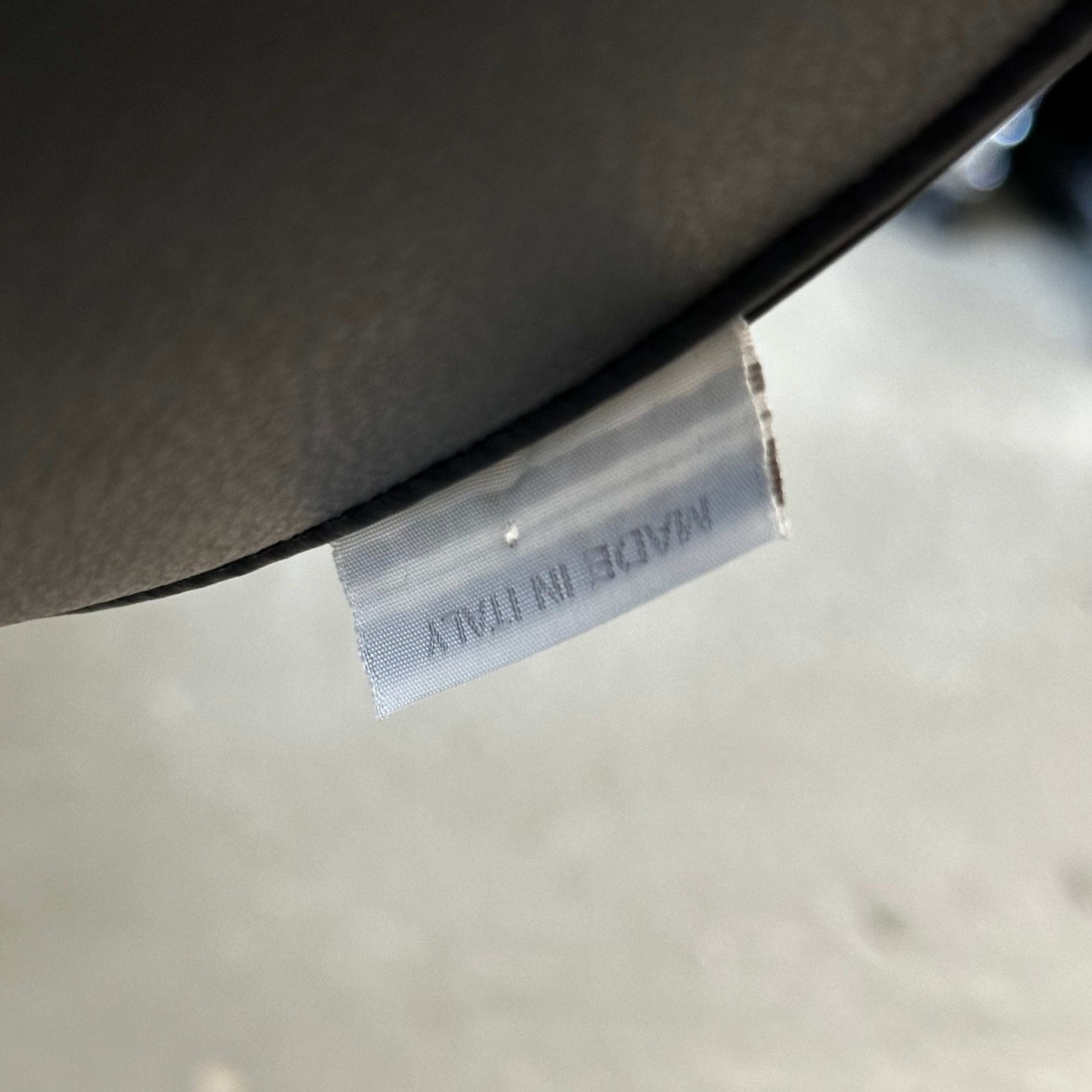 Close-up of Living Divani Ledersessel Jelly leather chair tag showing "Made in Italy" label