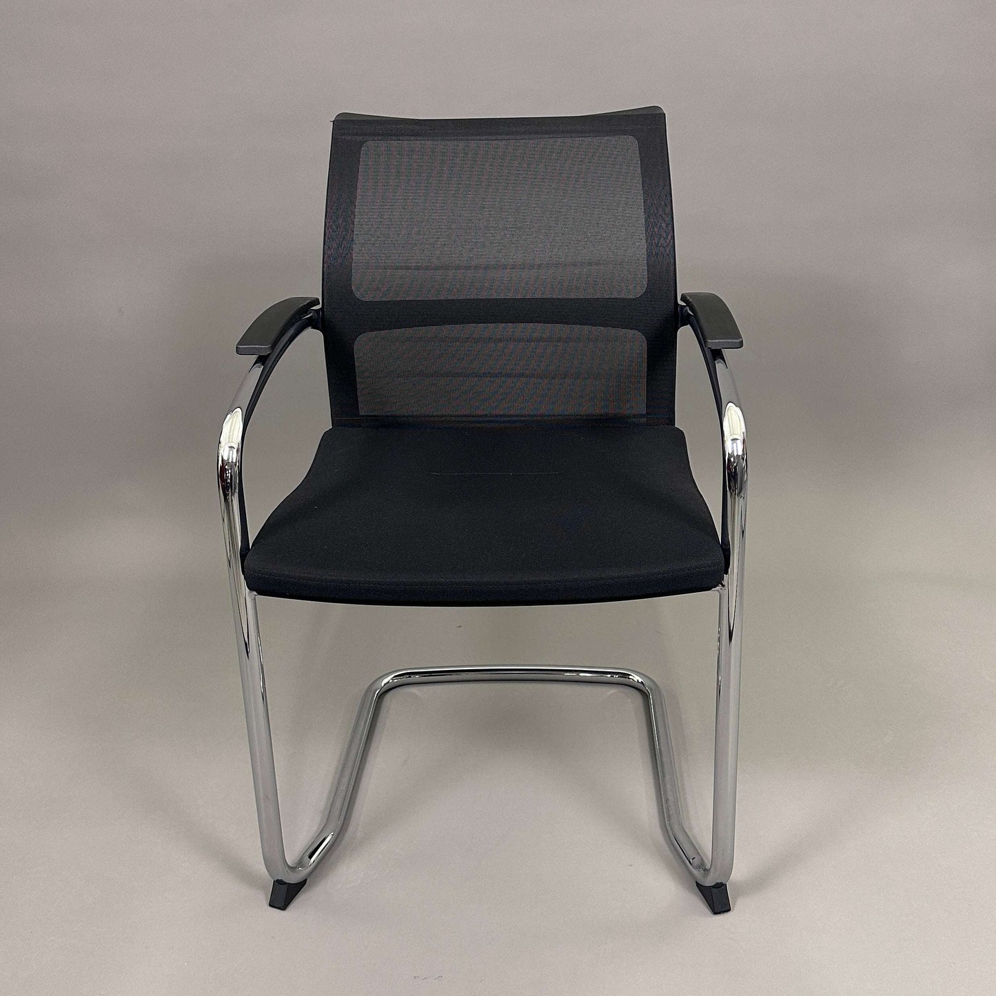 Sedus OpenUp Freischwinger chair with black mesh backrest and chrome frame