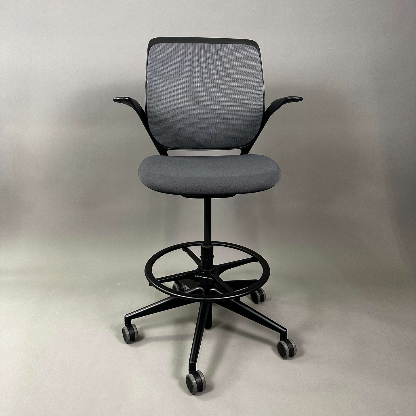 Steelcase Cobi ergonomic office chair with adjustable height, black frame, grey fabric seat, and mesh backrest on casters