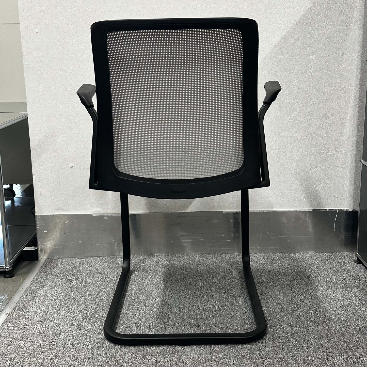 Steelcase Eastside Freischwinger black mesh office chair with cantilever base and ergonomic design viewed from the back