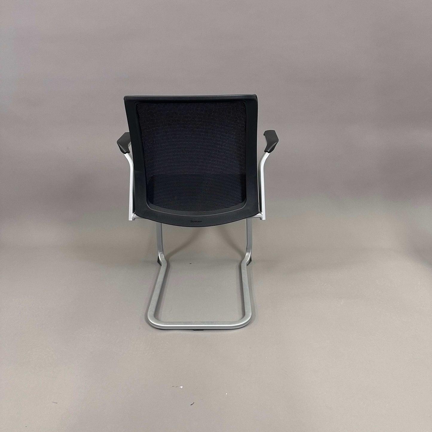 Steelcase Northside black mesh back meeting chair with silver frame, stackable office seating