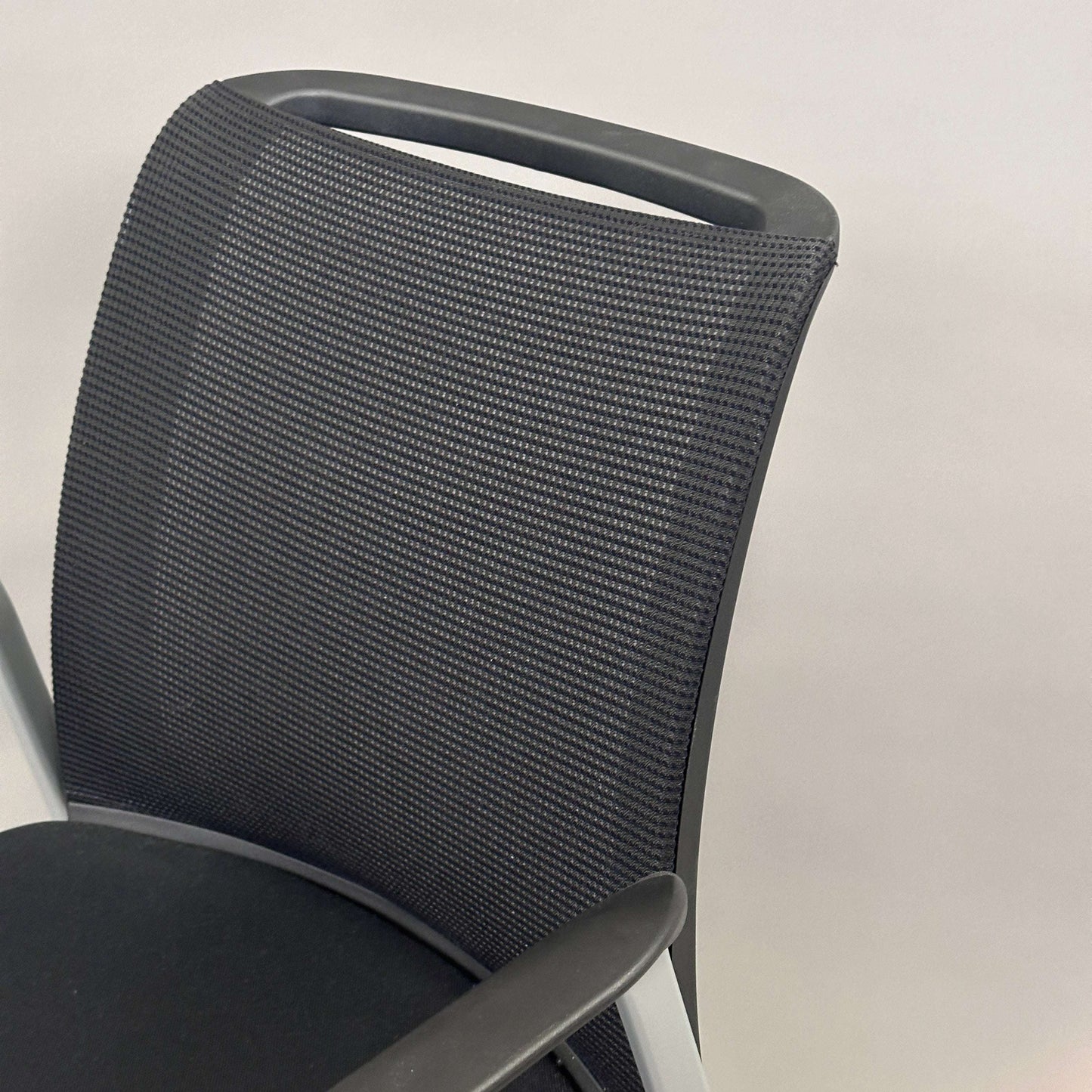 Steelcase Northside black mesh back meeting chair with silver frame and stackable design