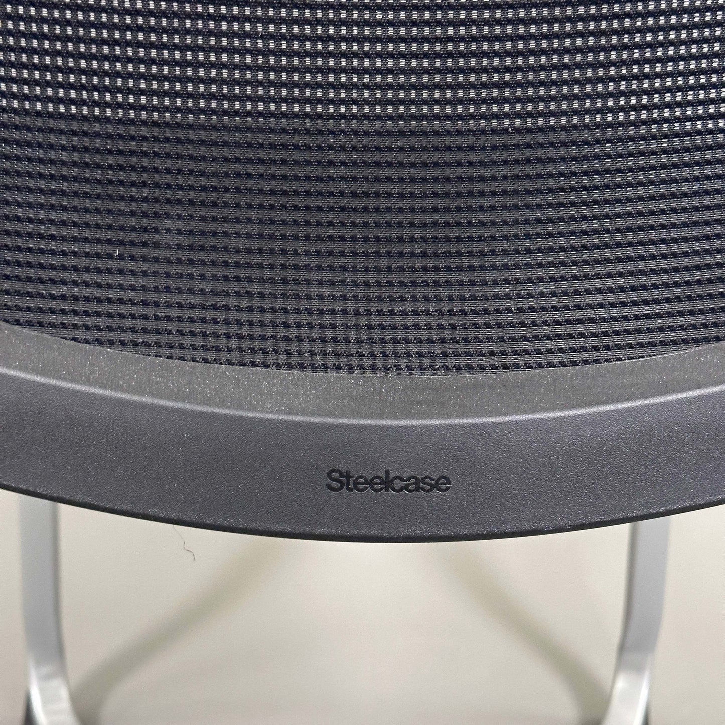 Steelcase Northside black mesh back meeting chair with silver frame and stackable design