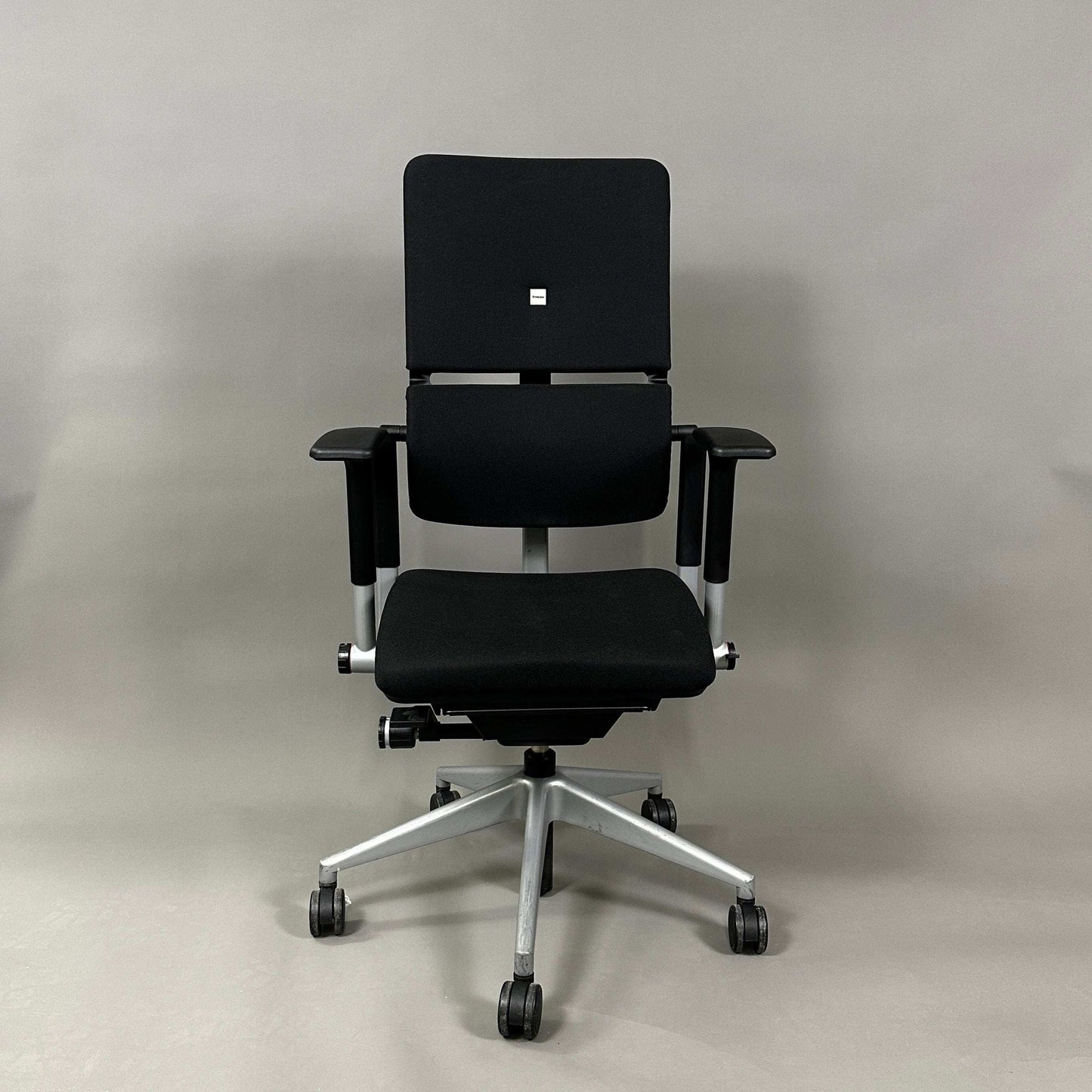 Steelcase Please V2 ergonomic black office chair with silver base and adjustable armrests