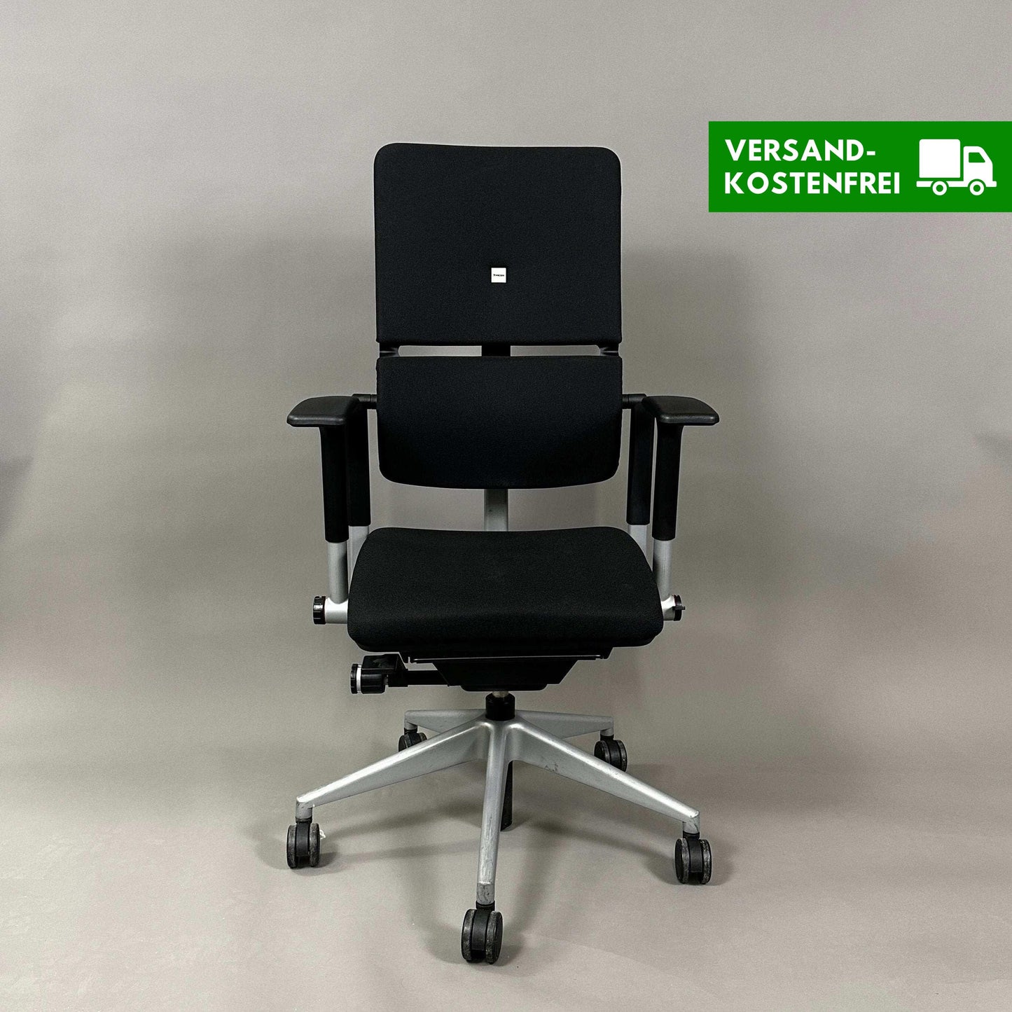 Steelcase Please V2 ergonomic black office chair with silver base and adjustable armrests