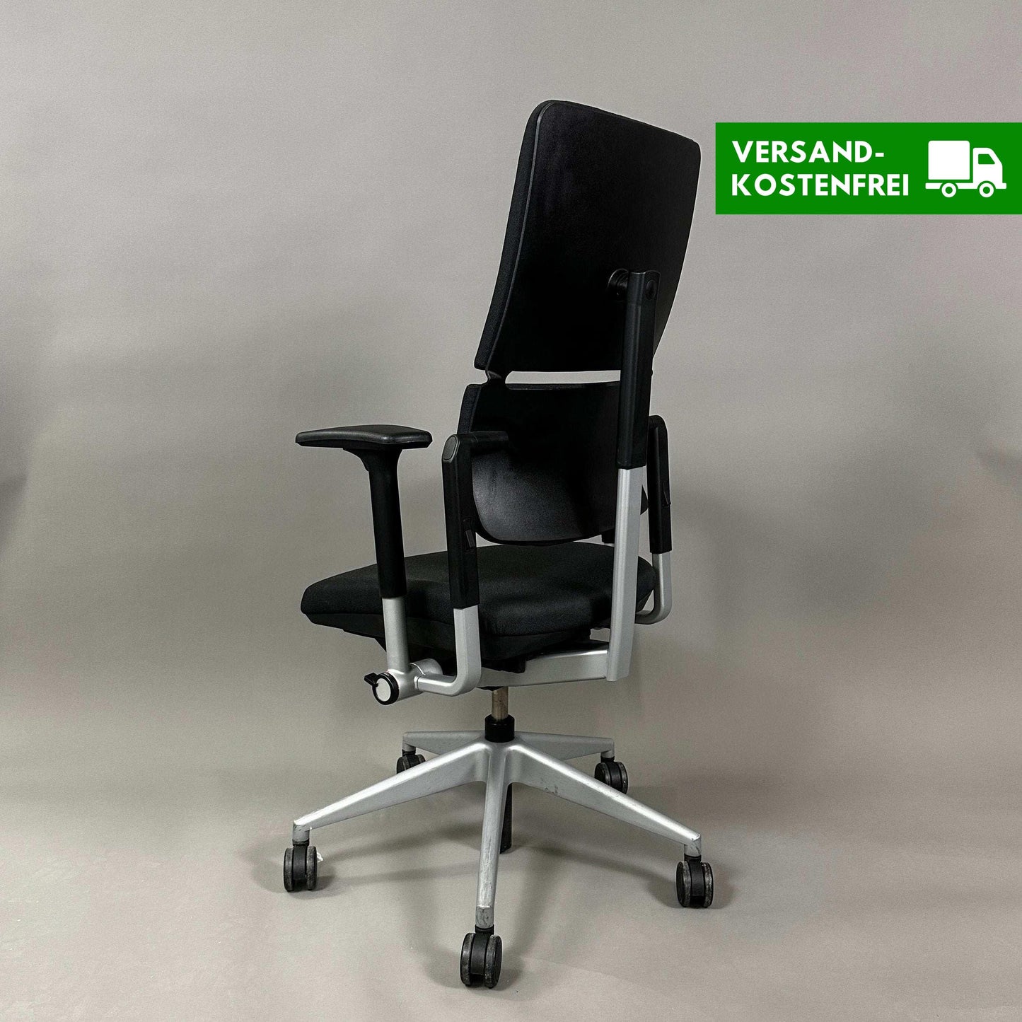 Steelcase Please ergonomic office chair in black and silver with adjustable armrests, lumbar support, and height-adjustable backrest