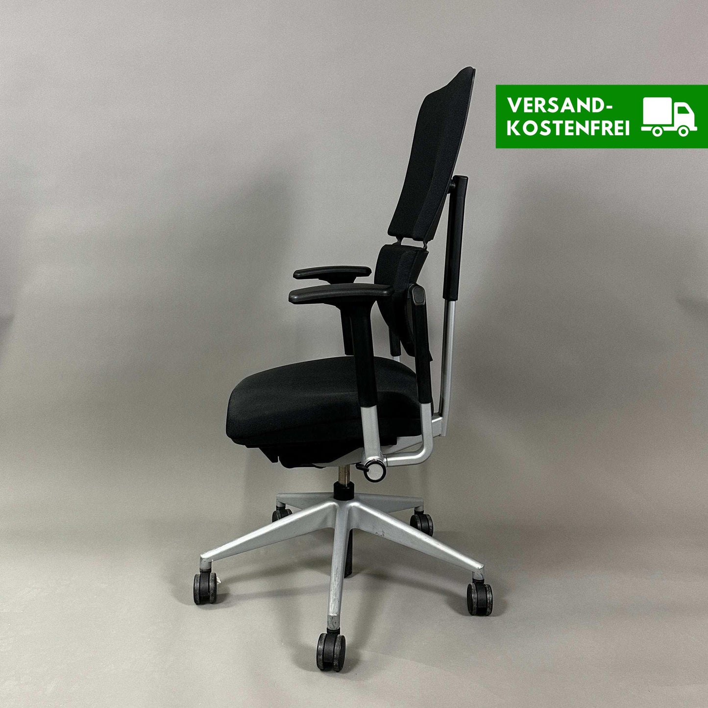 Steelcase Please ergonomic office chair in black with silver frame and adjustable armrests, lumbar support, and height-adjustable backrest