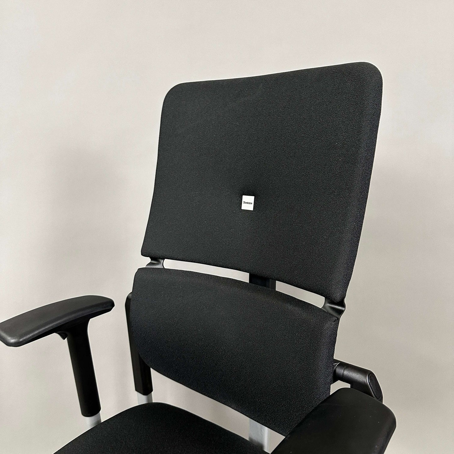 Steelcase Please V2 ergonomic office chair in black with adjustable armrests and lumbar support