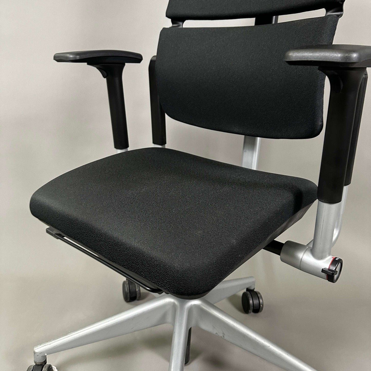 Steelcase Please black office chair with adjustable armrests and lumbar support on silver base