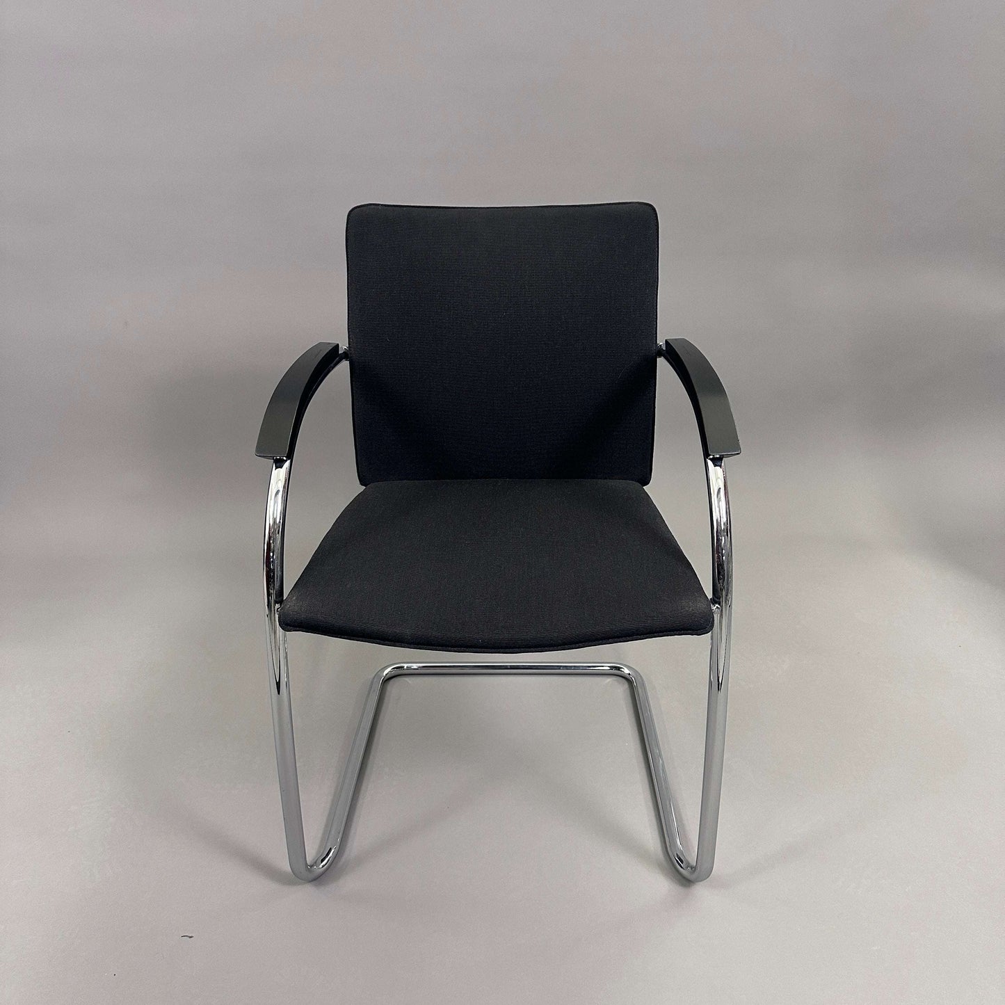 Thonet S78/S79 chair with black upholstery, matte black wooden armrests, and chrome frame