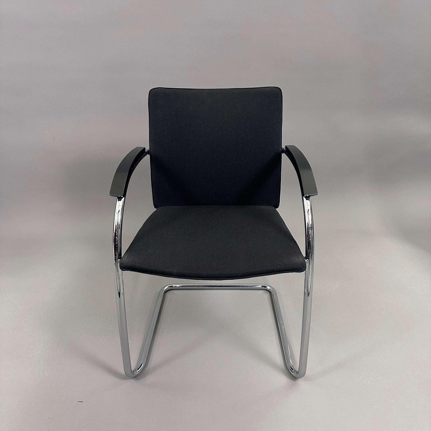 Thonet S78/S79 chair with black upholstery, matte black wooden armrests, and chrome frame