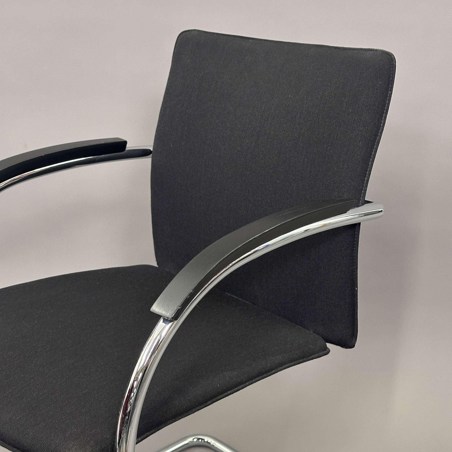 Thonet S78/S79 chair with black upholstery, matte black wooden armrests, and chrome frame