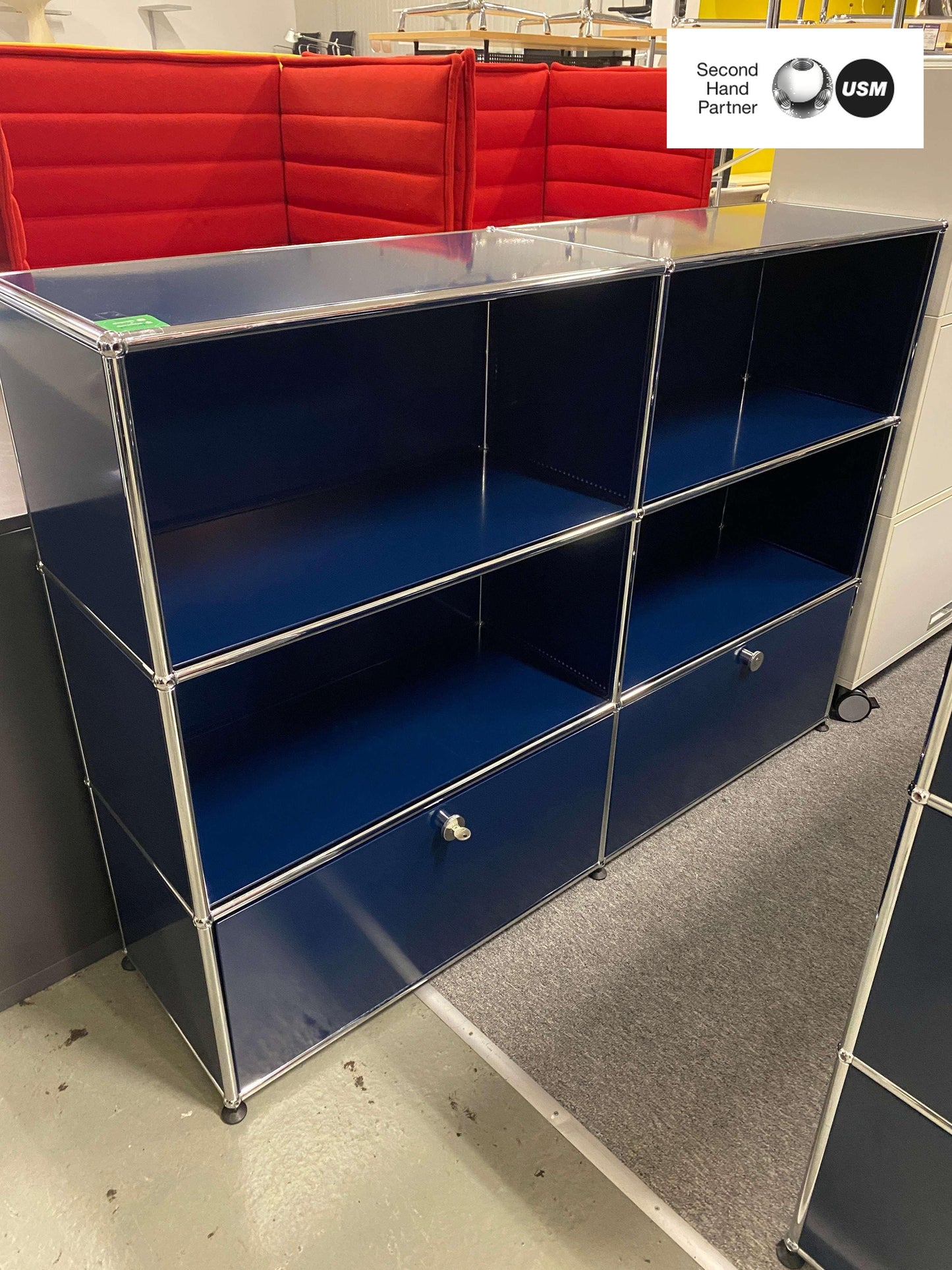 USM Haller highboard in steel blue with two lockable flaps and open shelving, measuring 153x109x38cm