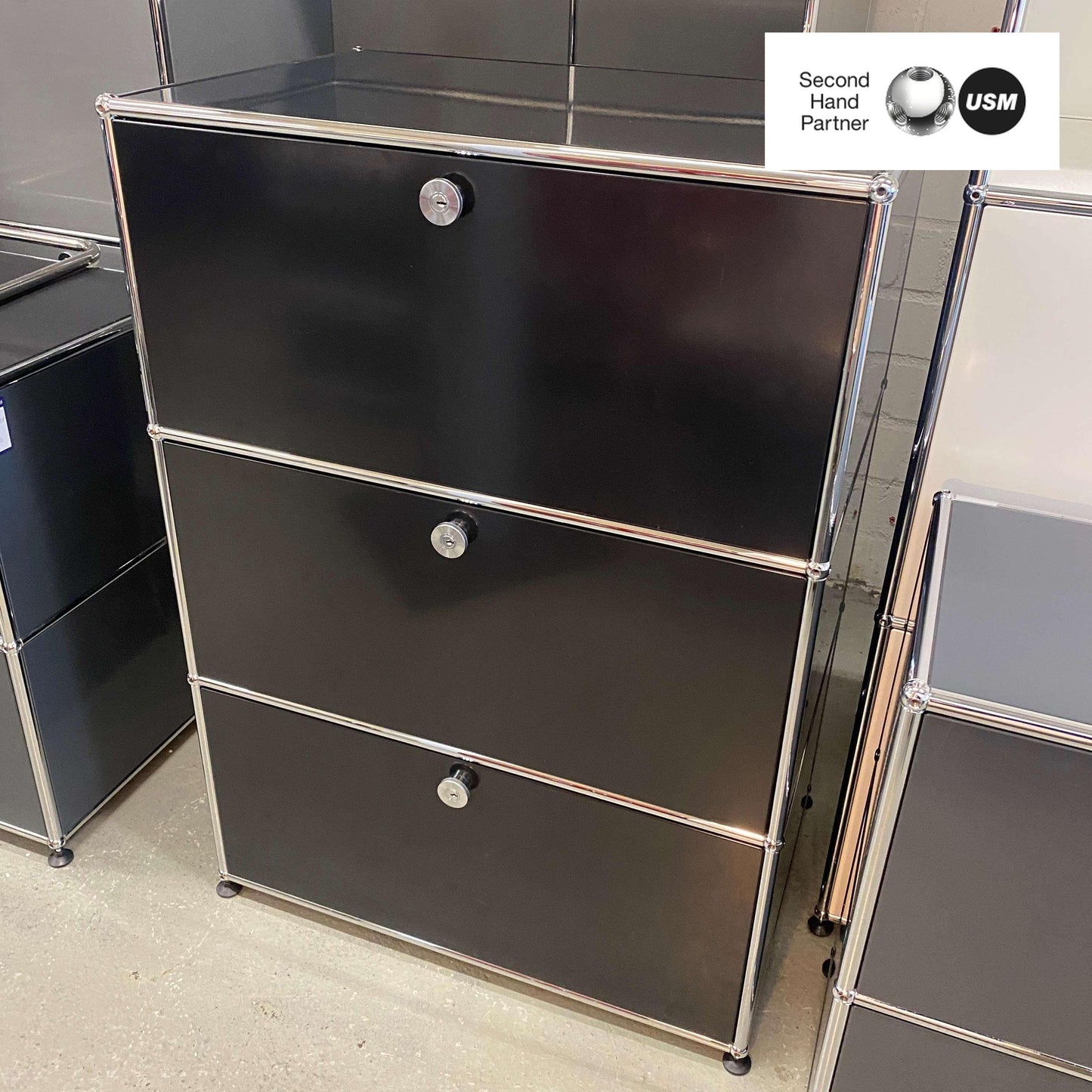 Black USM Haller Highboard with three drawers and chrome frame, 75x109x52cm
