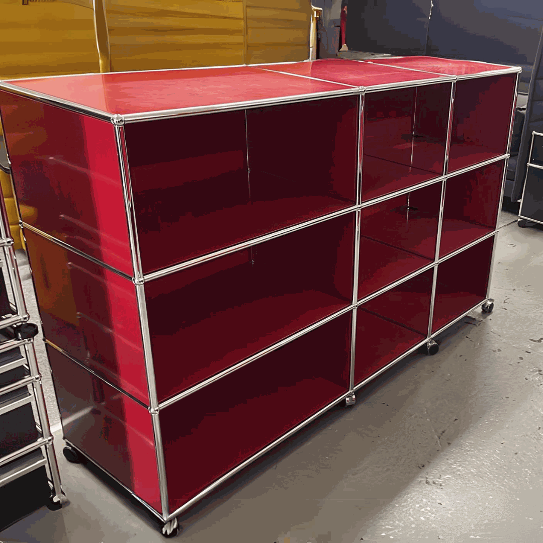 USM Haller Highboard in red with 9 open compartments and lockable caster wheels