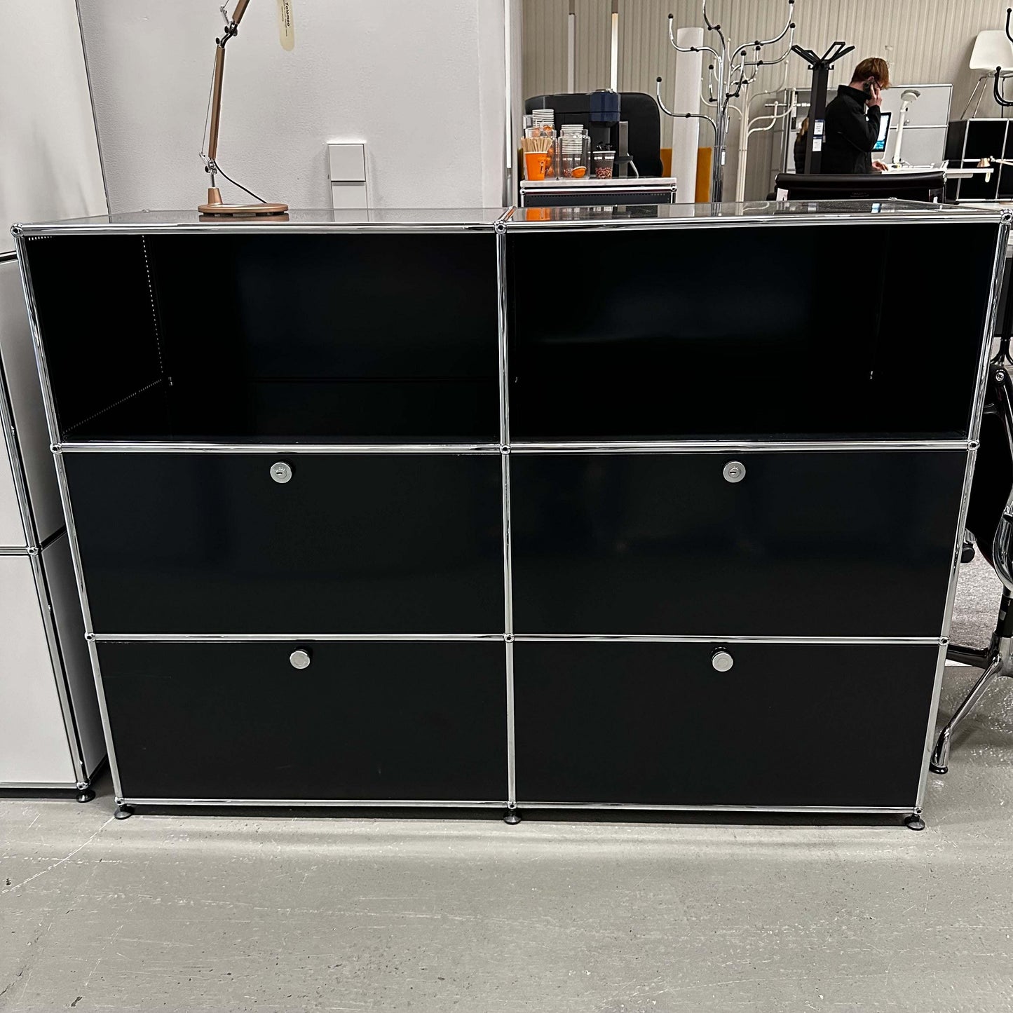 Black USM Haller highboard with 4 drawers and 2 open compartments, 152x110x52cm.