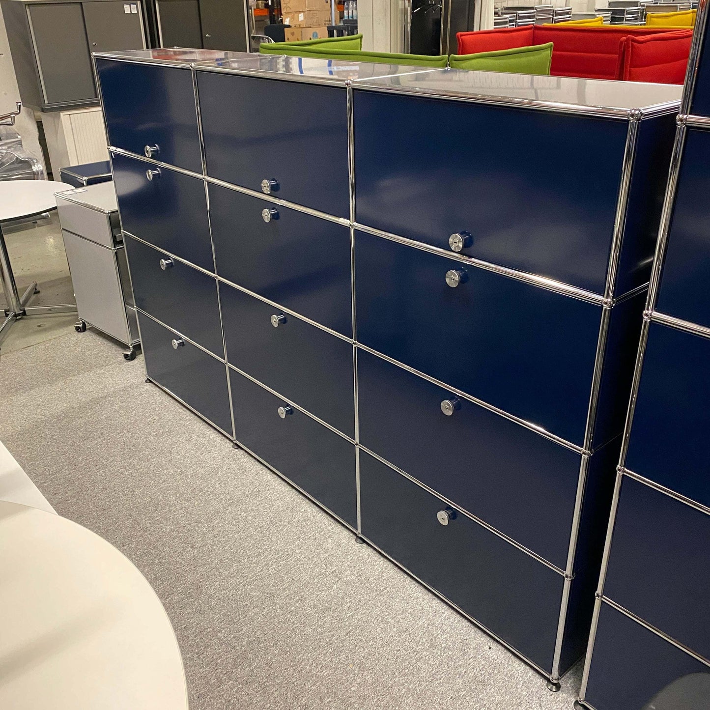 USM Haller Highboard in steel blue with 9 flap doors and 3 sliding doors, measuring 144x228x38cm