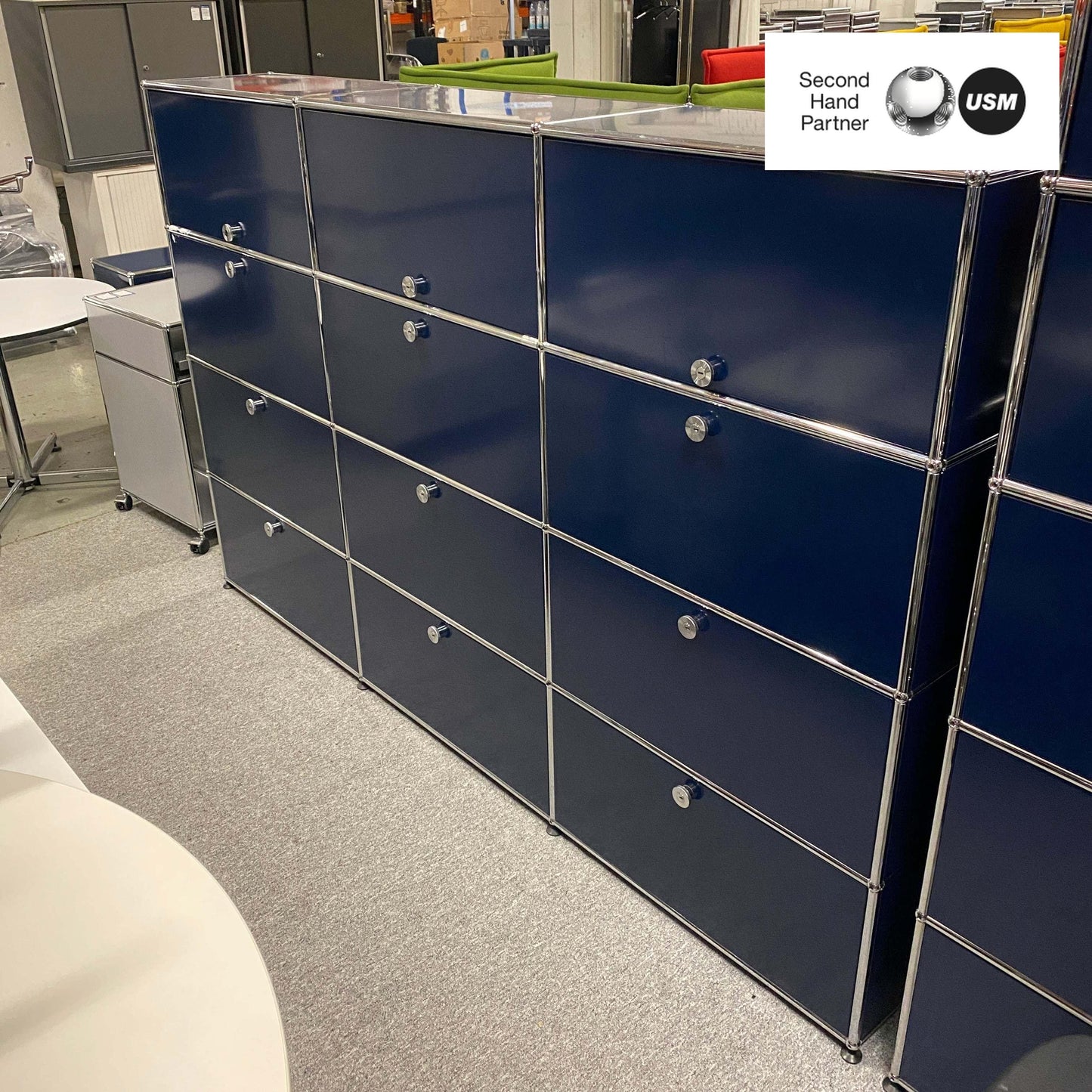 USM Haller Highboard in steel blue with 9 flap doors and 3 sliding doors, measuring 144x228x38cm