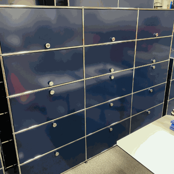 USM Haller Highboard in steel blue with 9 flap doors and 6 sliding doors measuring 179x228x38cm