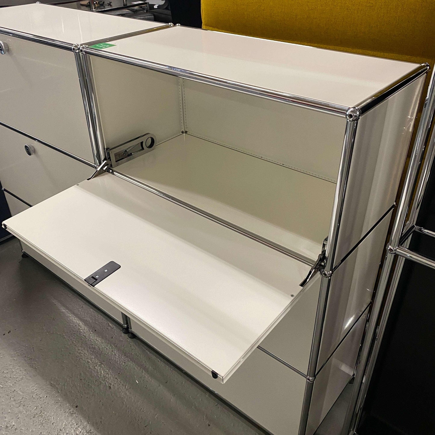 USM Haller Highboard white 1x3 with three fold-down doors and chrome frame, 109x78x38cm