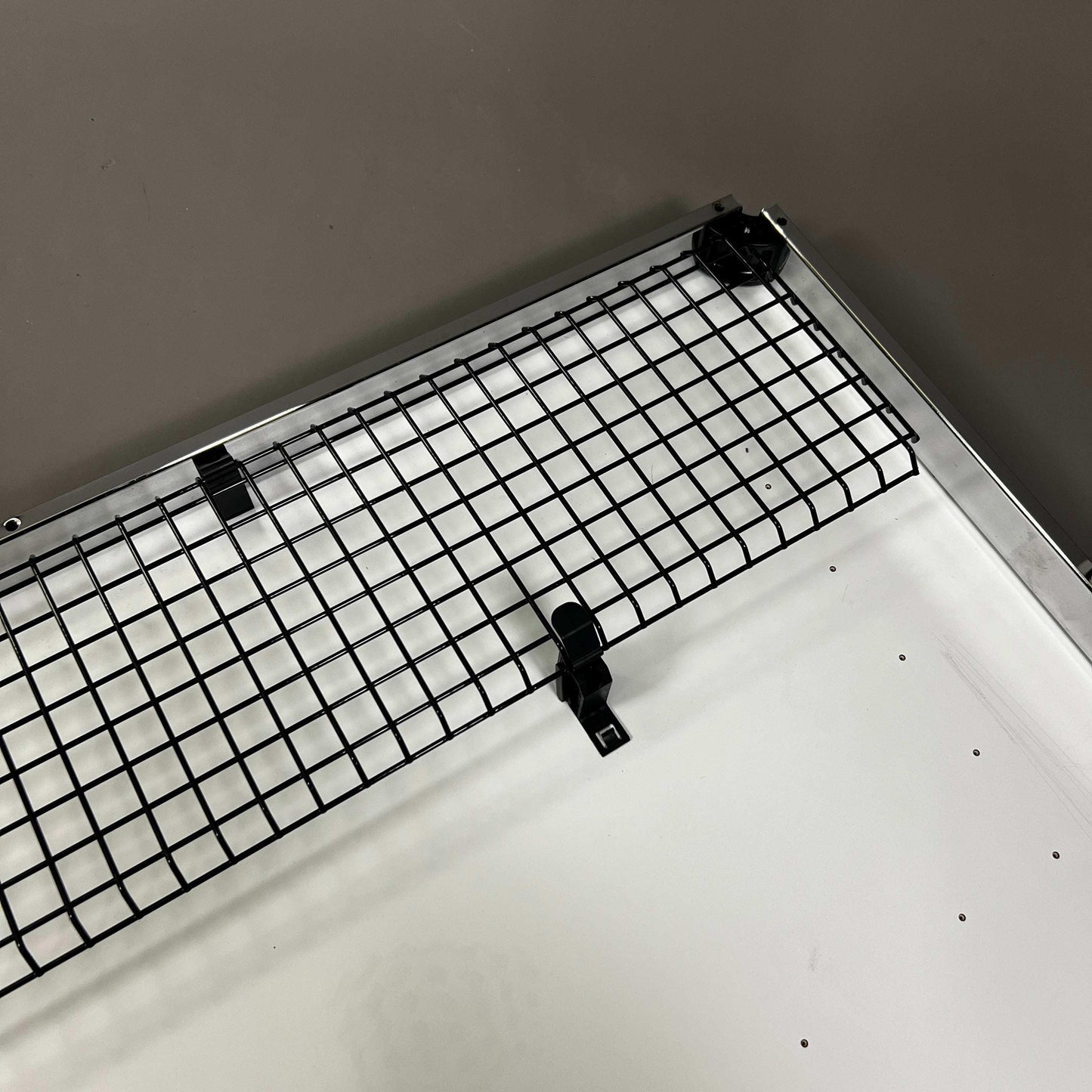 USM Haller Kabelkorb foldable black metal cable organizer mounted under desk for cable management