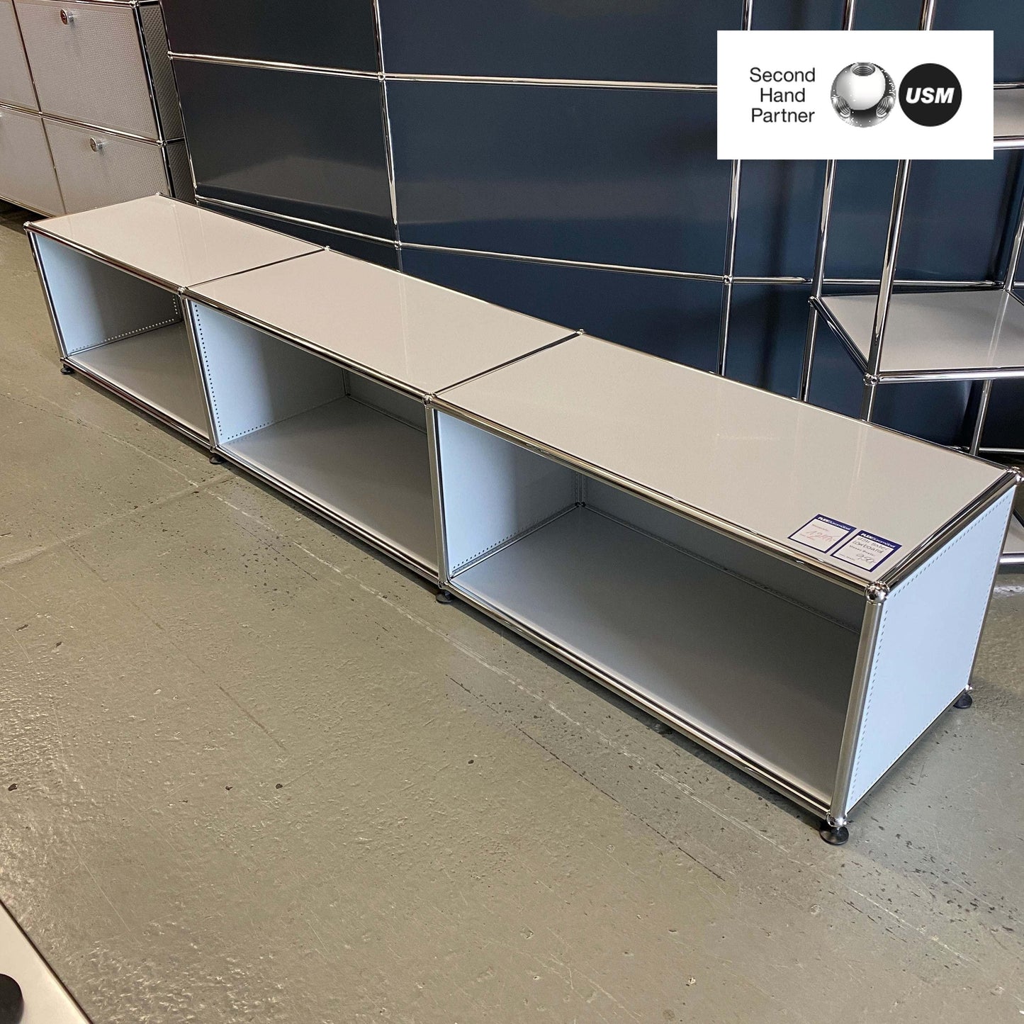 USM Haller Lowboard in light gray with three open compartments and 228x38x38cm dimensions