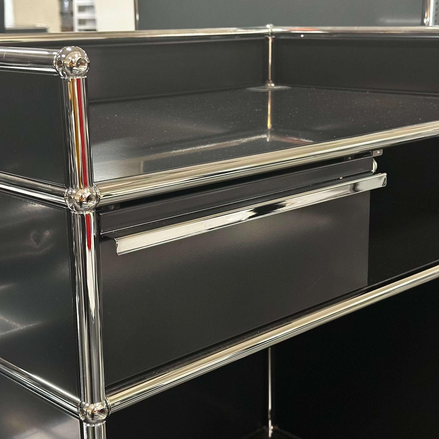 USM Haller Pult highboard in graphite black with chrome frame and 77x117x52cm dimensions
