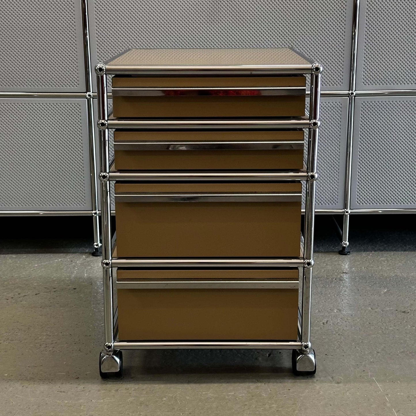 USM Haller beige rollcontainer with four drawers and chrome frame on wheels