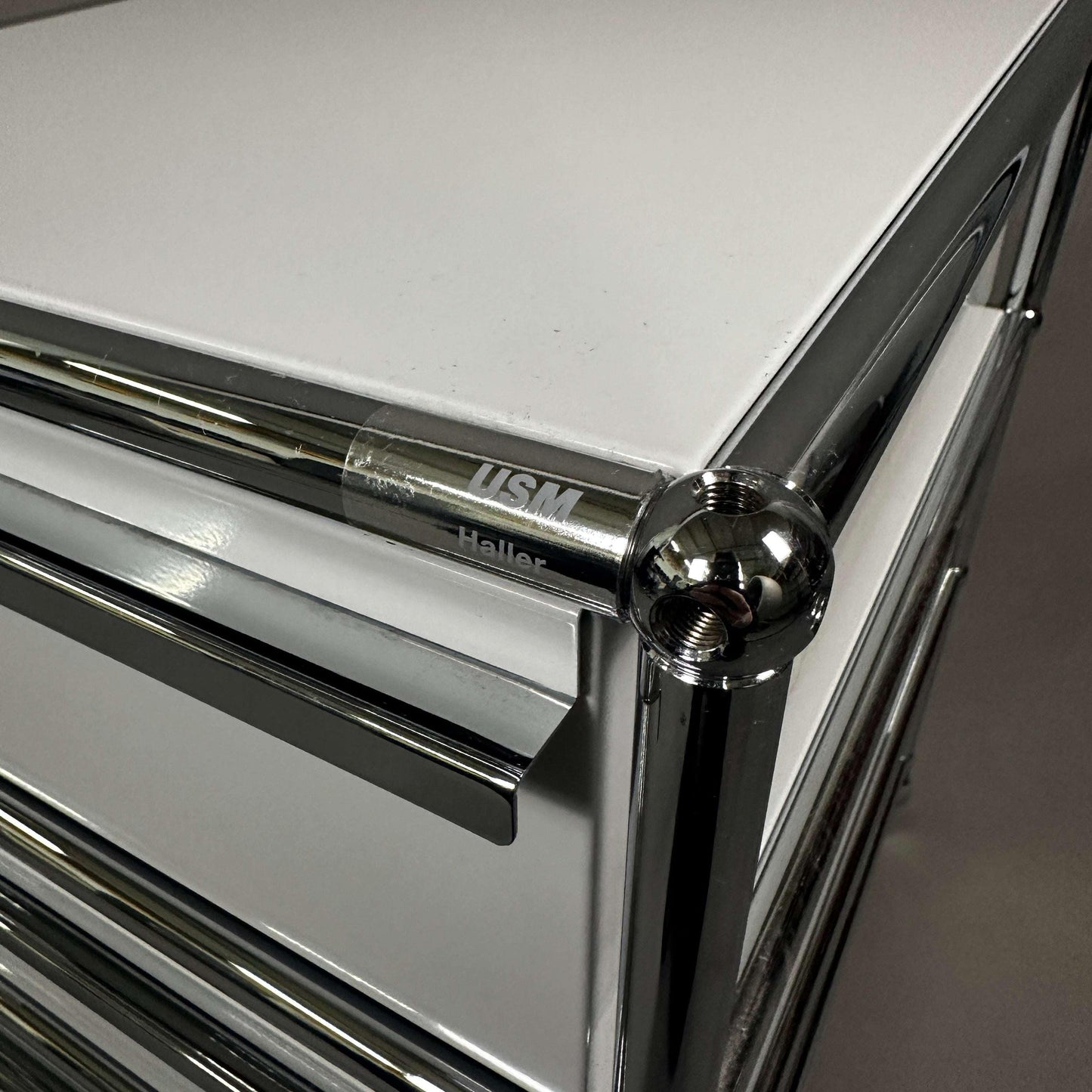 USM Haller light gray roll container with three drawers and chrome accents
