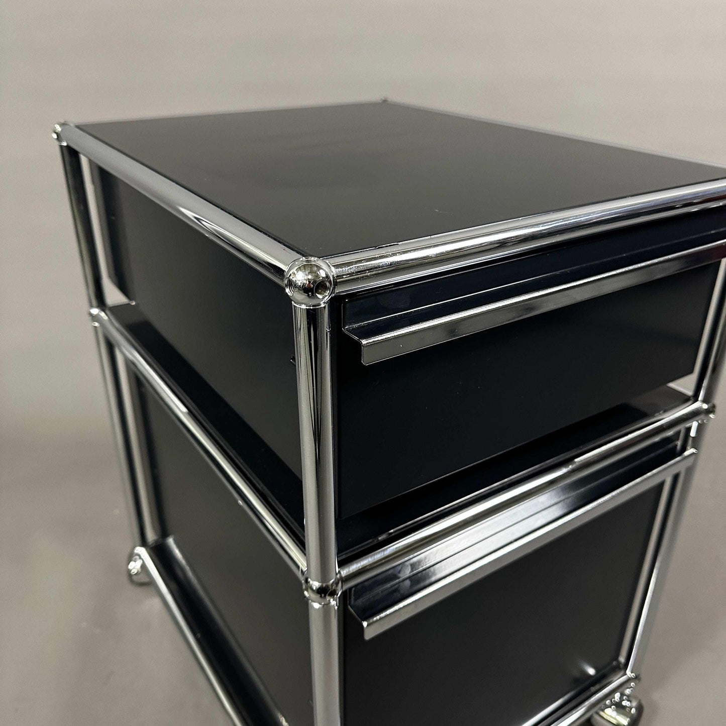USM Haller Rollcontainer in graphite black with two drawers and chrome frame