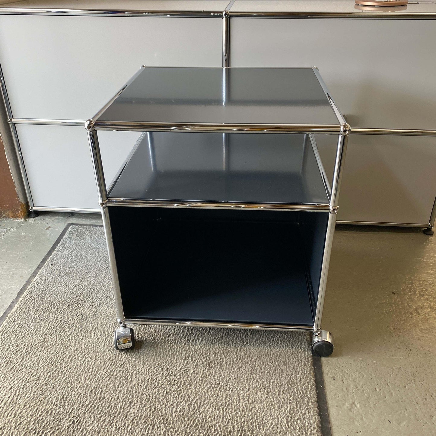 USM Haller Rollcontainer anthracite side table with open shelf and compact design on wheels, 53x53x62cm dimensions