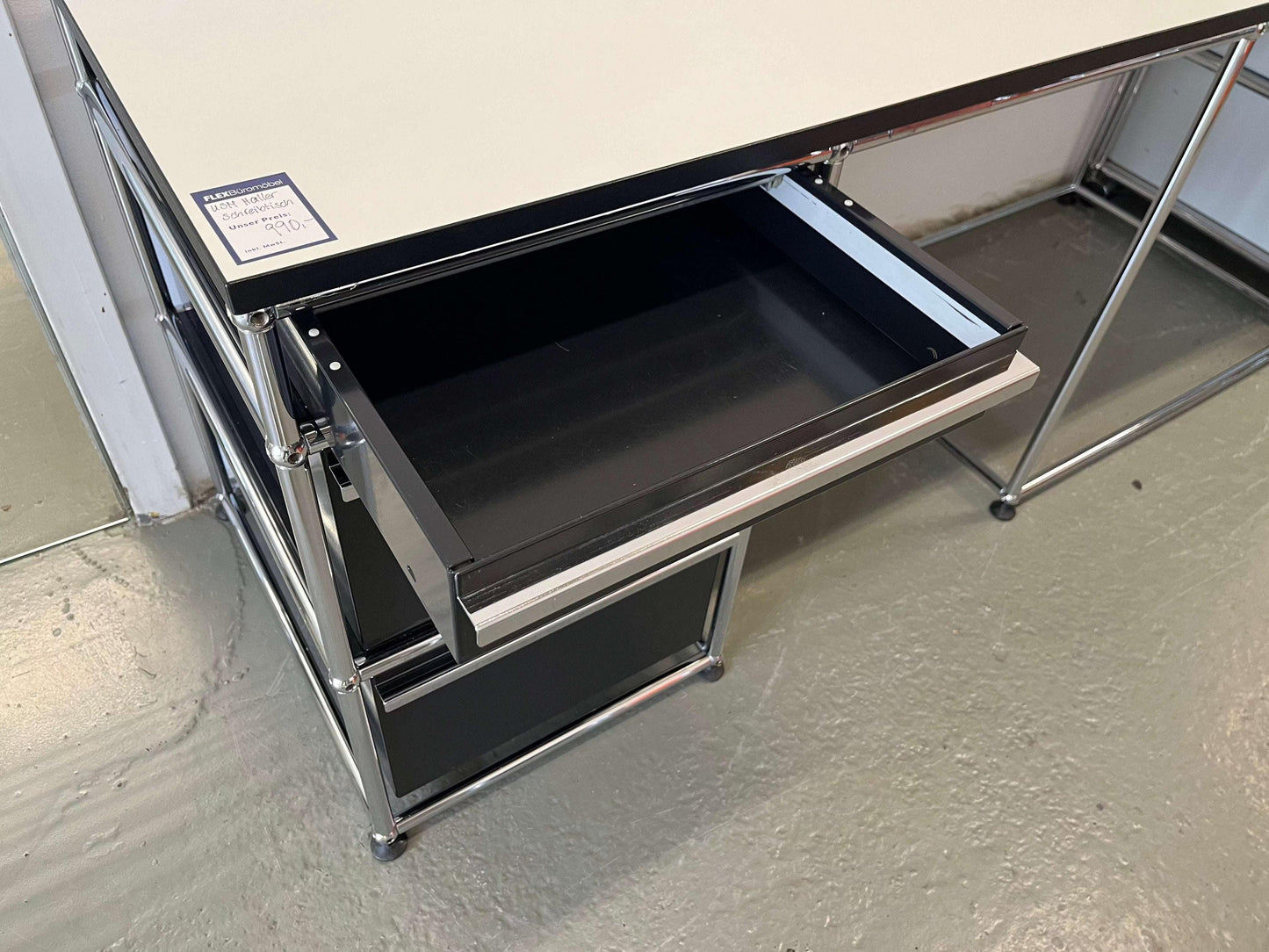 USM Haller desk with graphit black drawer unit and perlgrau tabletop with black edge