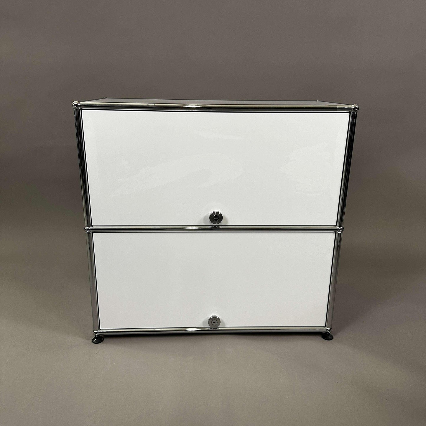 USM Haller light gray sideboard with two sliding compartments and chrome frame