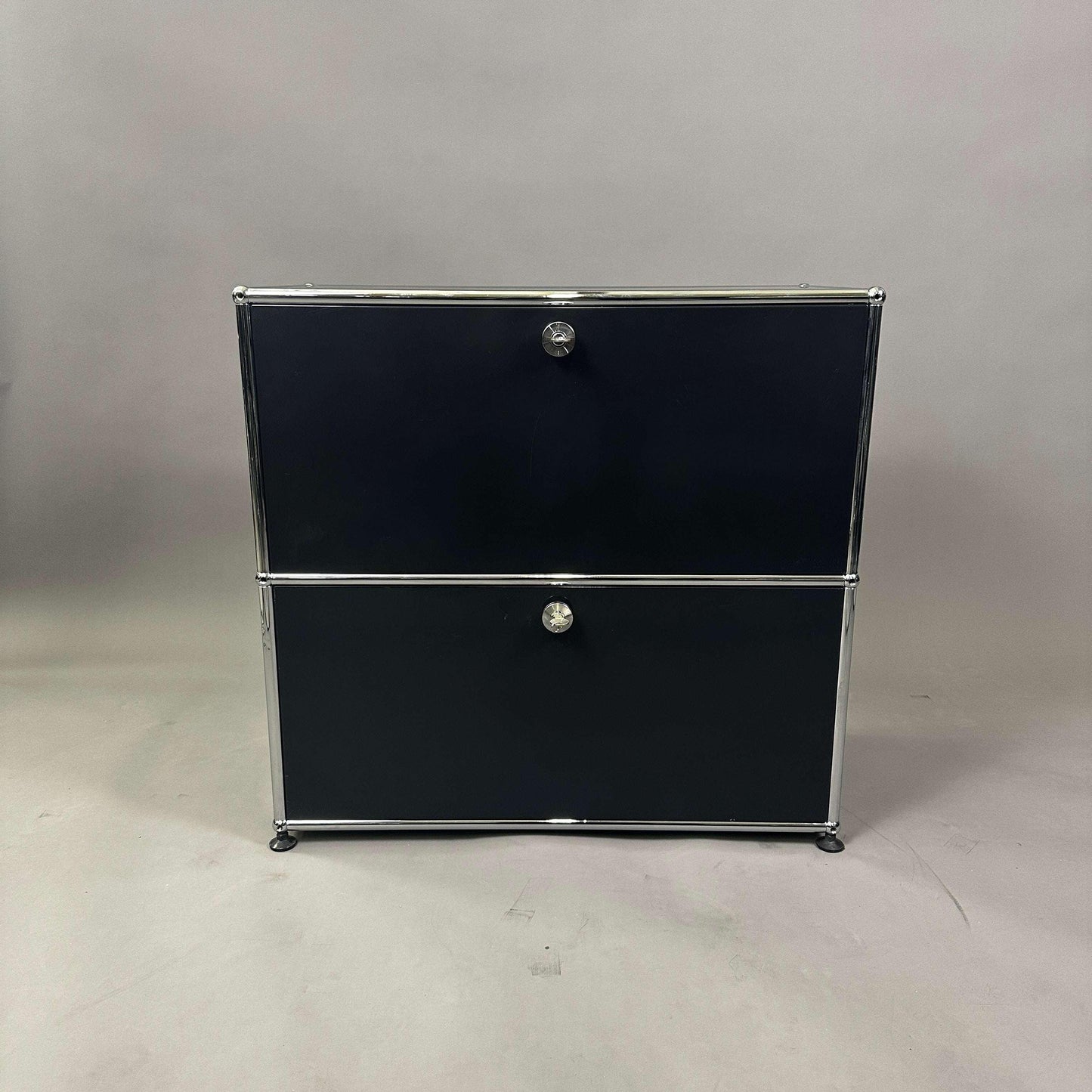 USM Haller Sideboard 1x2 in graphite black with two lockable flap doors and chrome frame, 74x78x38 cm