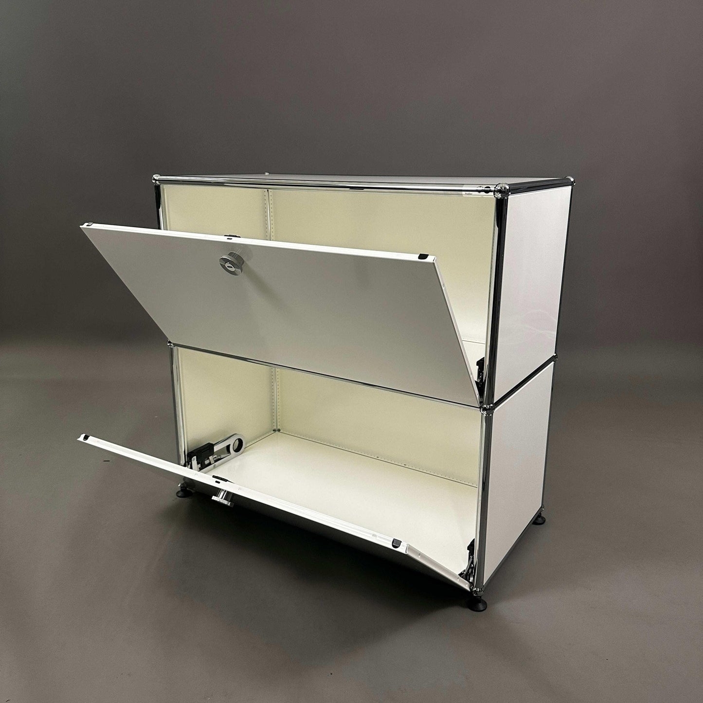 USM Haller white sideboard with two drop-down doors and steel frame