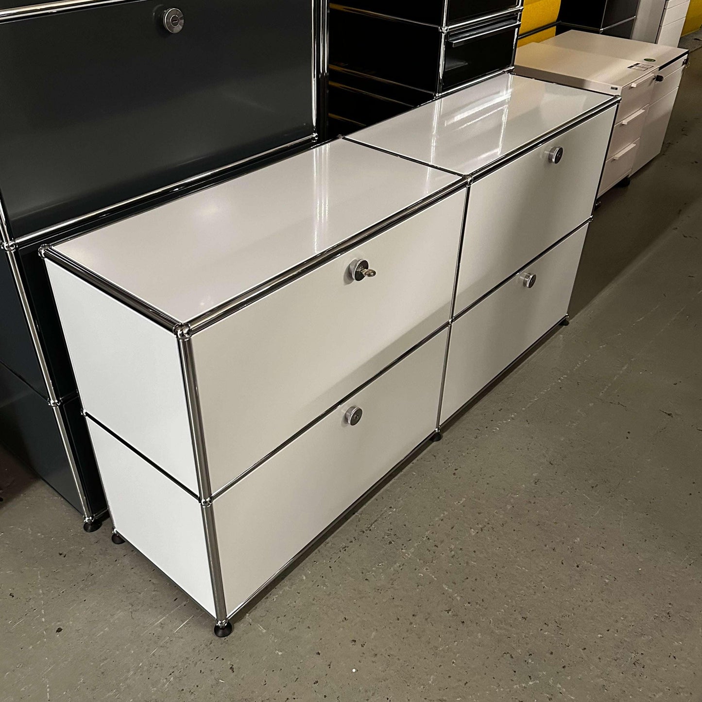 White USM Haller Sideboard with chrome frame, sleek modern design and multiple storage compartments