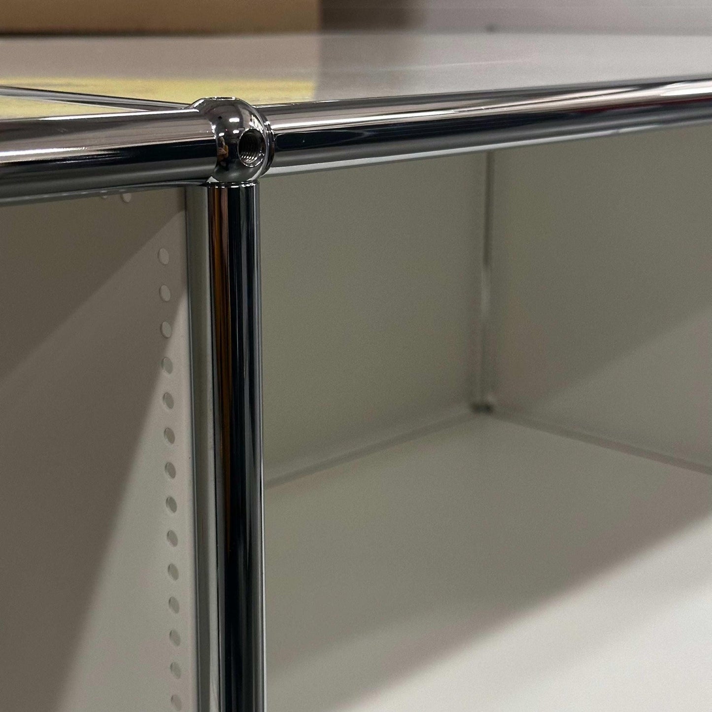 White USM Haller Sideboard with chrome frame and 127x74x52cm dimensions