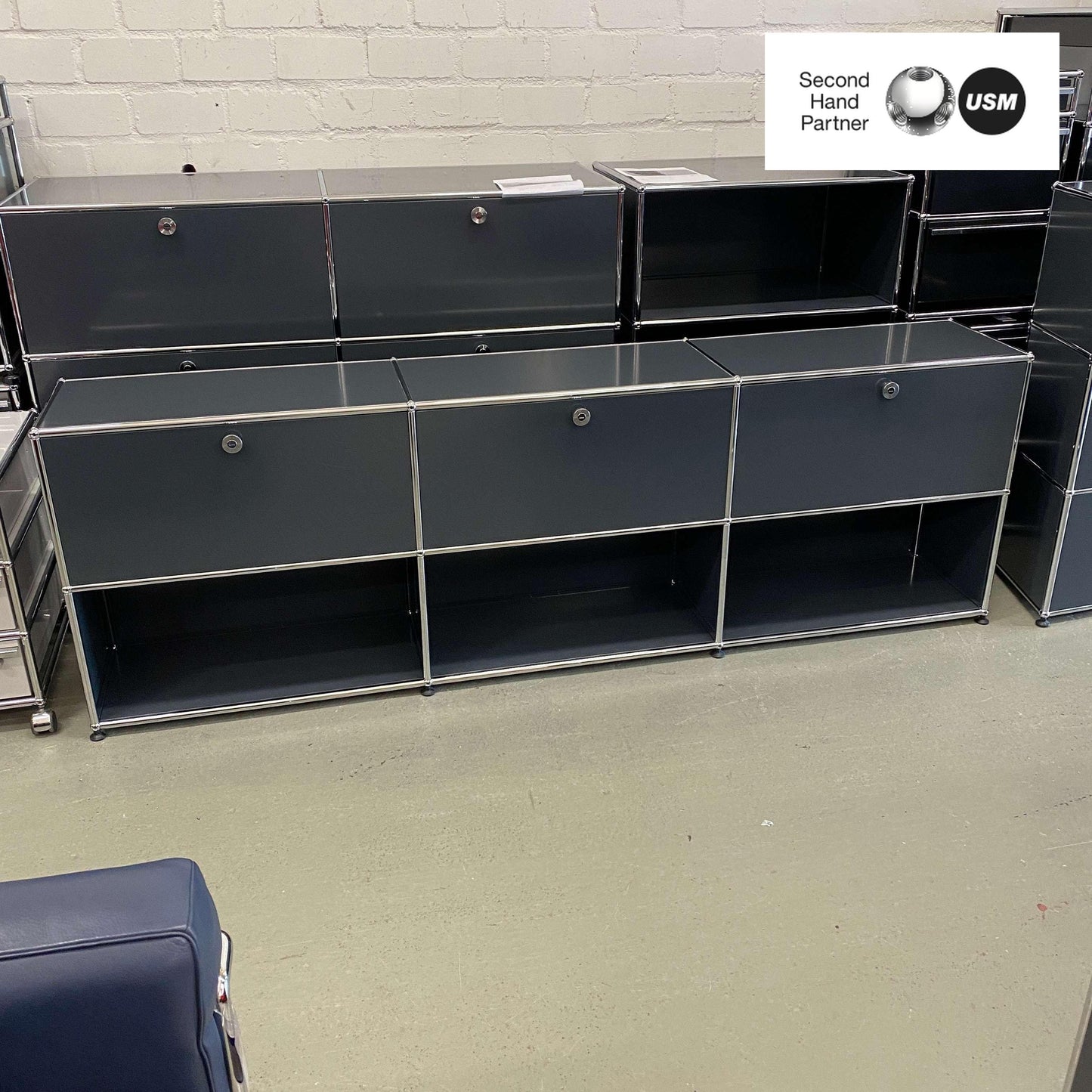USM Haller anthracite sideboard with 2x3 compartments and 3 flap doors, measuring 227x37x74 cm
