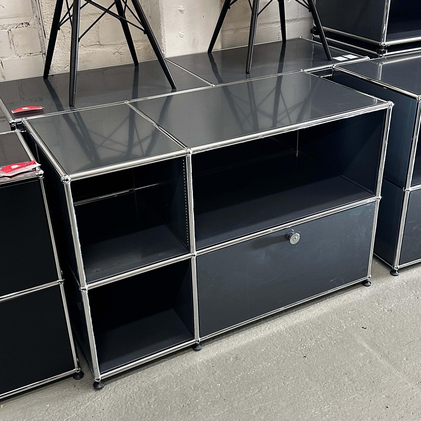 USM Haller Sideboard in anthracite with open shelves and closed compartment, sleek modular metal design for versatile storage.