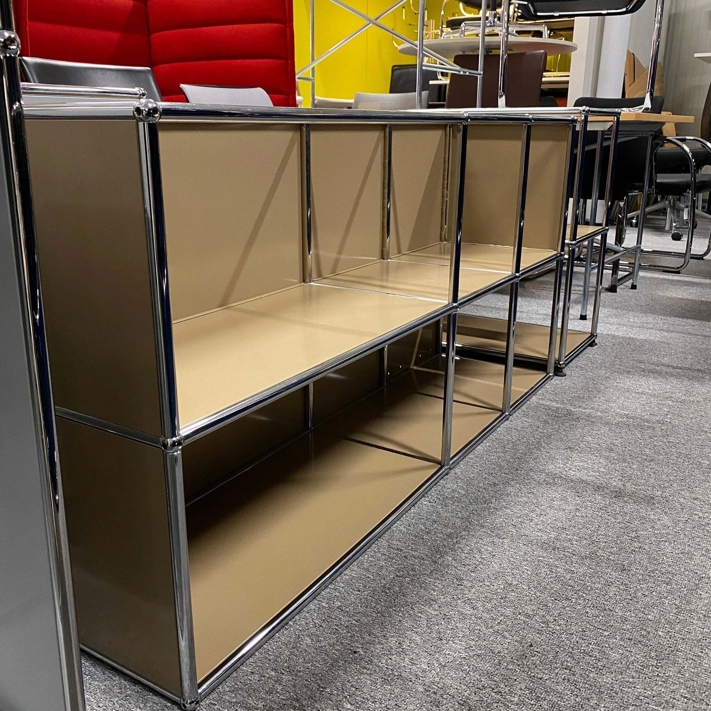 USM Haller Sideboard beige 3x2 open shelving unit with chrome frame on office carpet floor